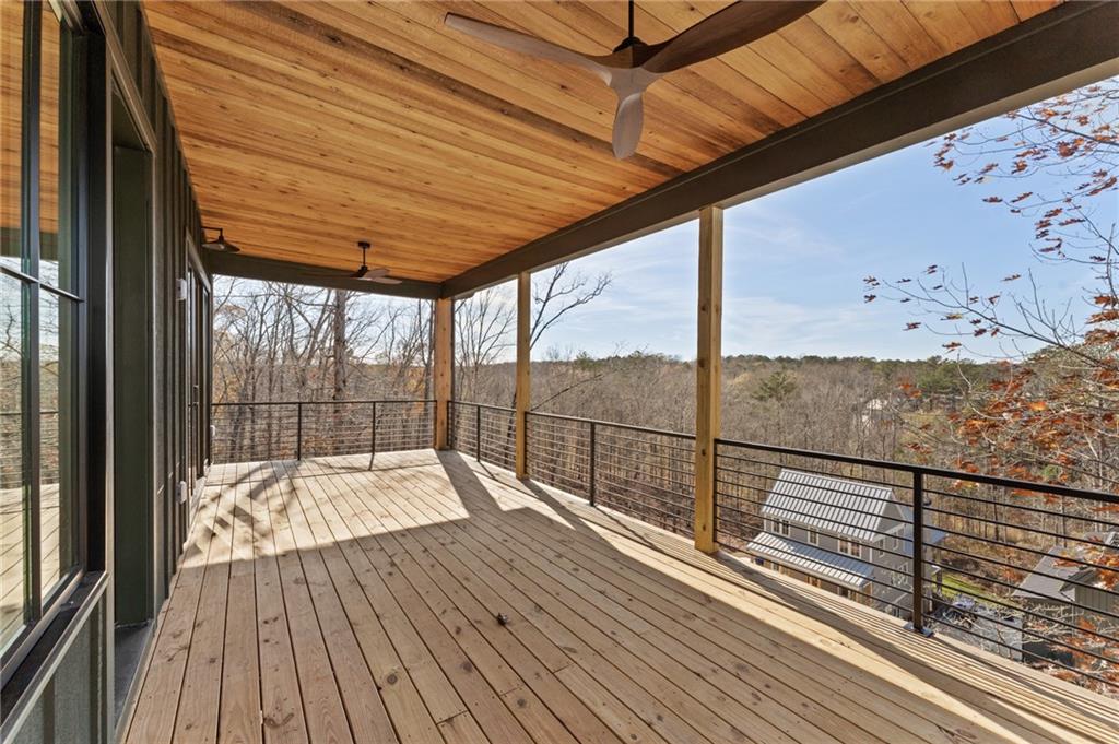 1090 Lupo Loop Chattahoochee Hills, GA 30268 - Photo 14 of 23 a view of a balcony with wooden floor