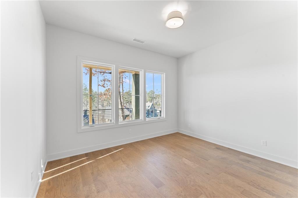 1090 Lupo Loop Chattahoochee Hills, GA 30268 - Photo 17 of 23 an empty room with a window