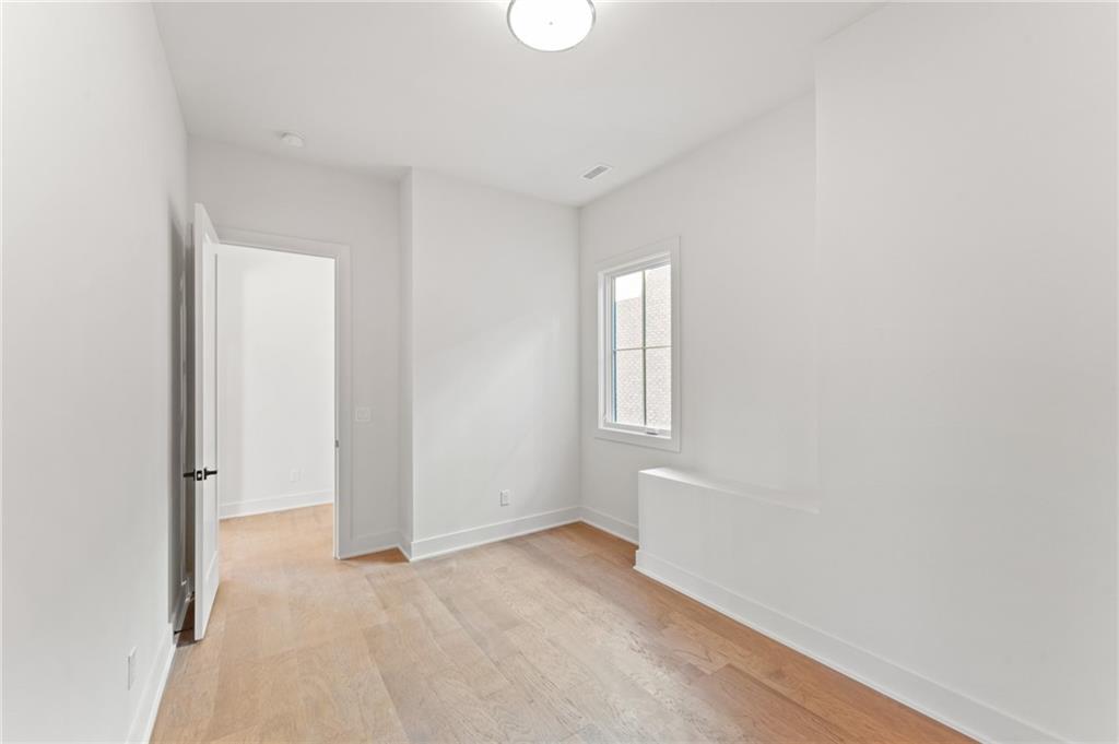 1090 Lupo Loop Chattahoochee Hills, GA 30268 - Photo 20 of 23 a view of an empty room with a window