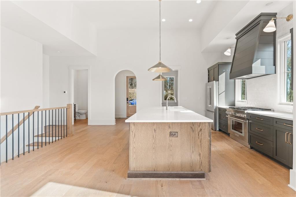 1090 Lupo Loop Chattahoochee Hills, GA 30268 - Photo 3 of 23 a large kitchen with a table and chairs