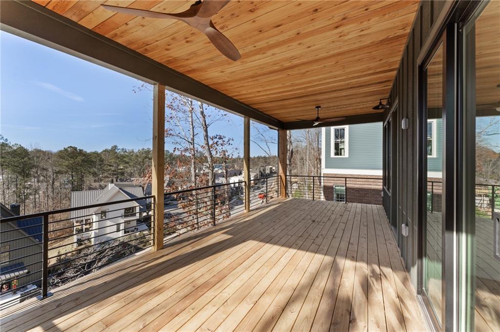 1090 Lupo Loop Chattahoochee Hills, GA 30268 - Photo 10 of 23 a view of balcony with wooden floor