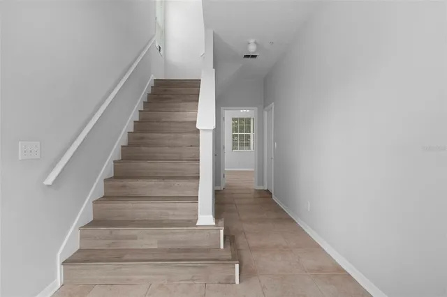 a view of a livingroom with a staircase