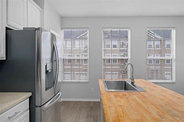 a kitchen with cabinets appliances and a counter space