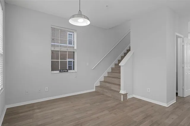 a view of a livingroom with a ceiling fan and window