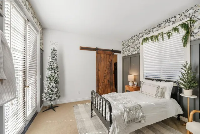 a kitchen with granite countertop stainless steel appliances a sink stove and cabinets