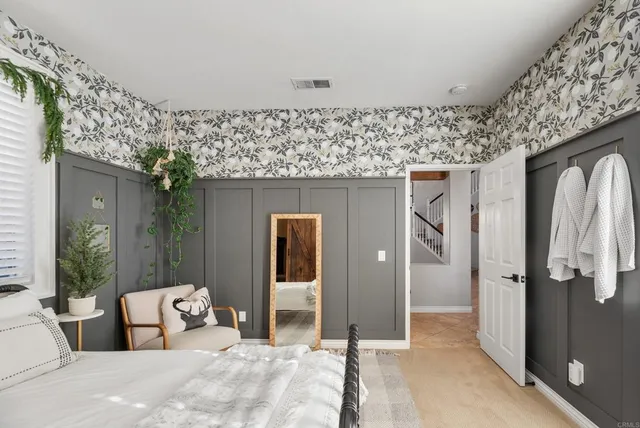 a view of a livingroom with furniture and large windows