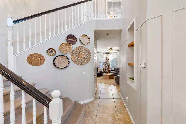a bathroom with a double vanity sink mirror and shower