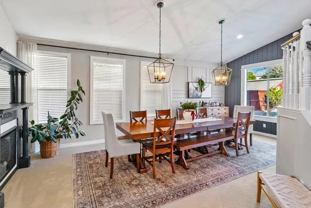 a view of a dining room and livingroom furniture wooden floor and a chandelier