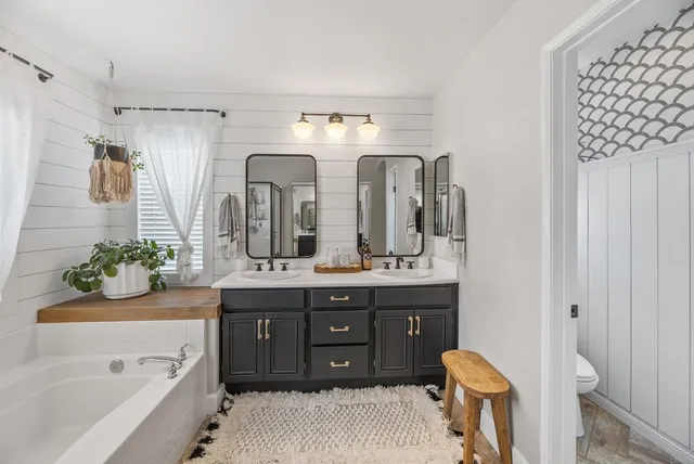 a view of a patio with table and chairs and potted plants