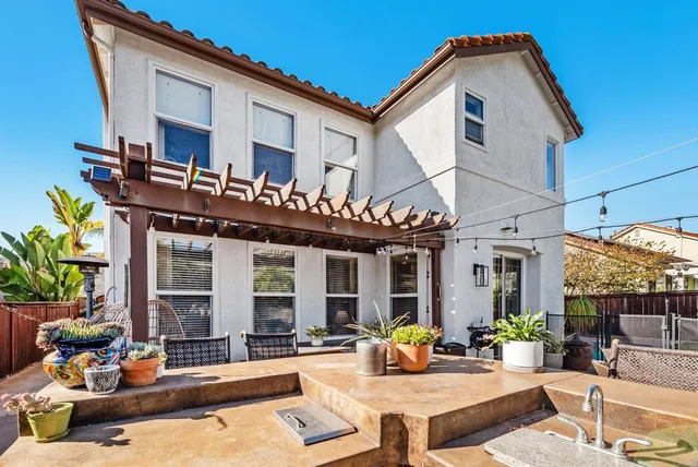 an aerial view of residential houses with outdoor space and swimming pool
