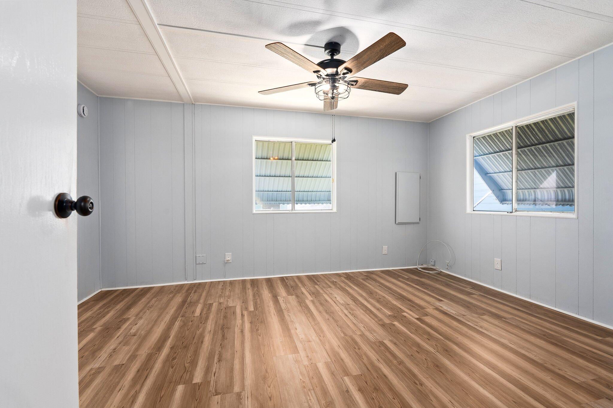 4800 Southeast Federal Highway, Unit 53 Stuart, FL 34997 - Photo 24 of 36 a view of a big room with wooden floor and windows