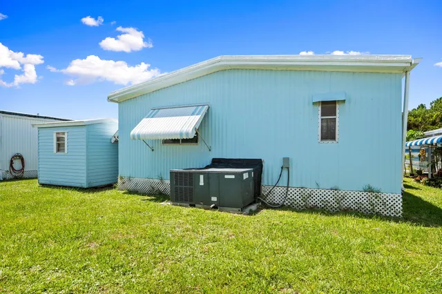 a backyard of a house with yard and garage