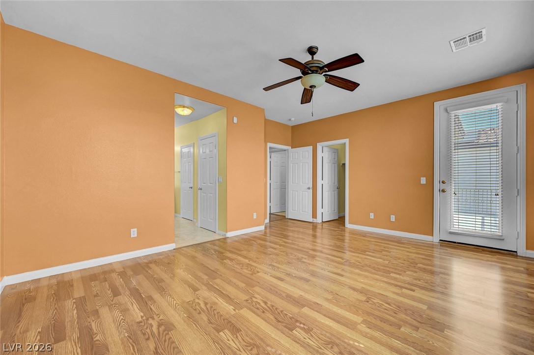 977 Sparkling Light Street Henderson, NV 89052 - Photo 44 of 75 This versatile space features durable hardwood floors and access to an outdoor area, perfect for everyday living.