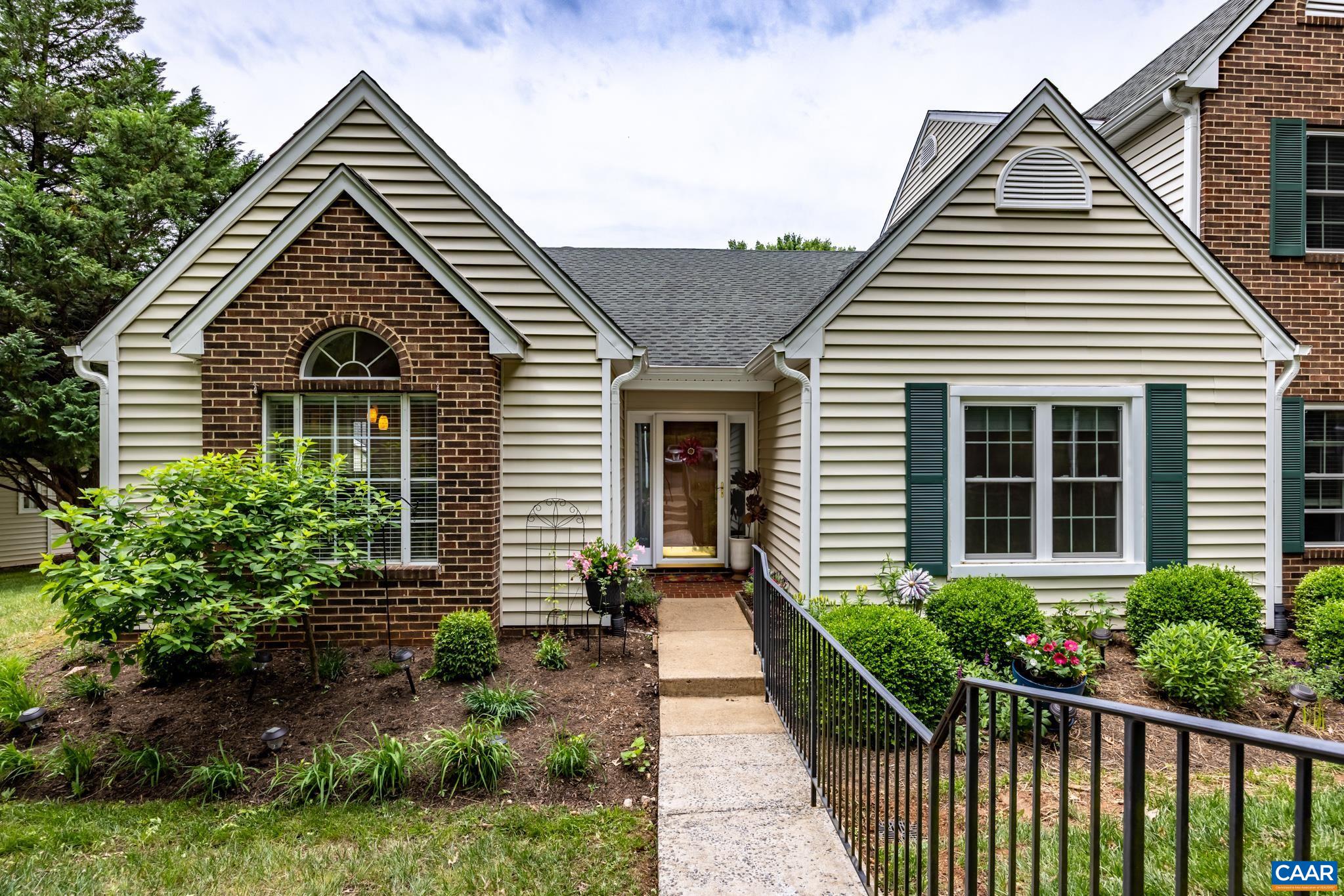 3272 Arbor Trace Charlottesville, VA 22911 - Photo 1 of 46 a view of a house with a small yard plants and large tree