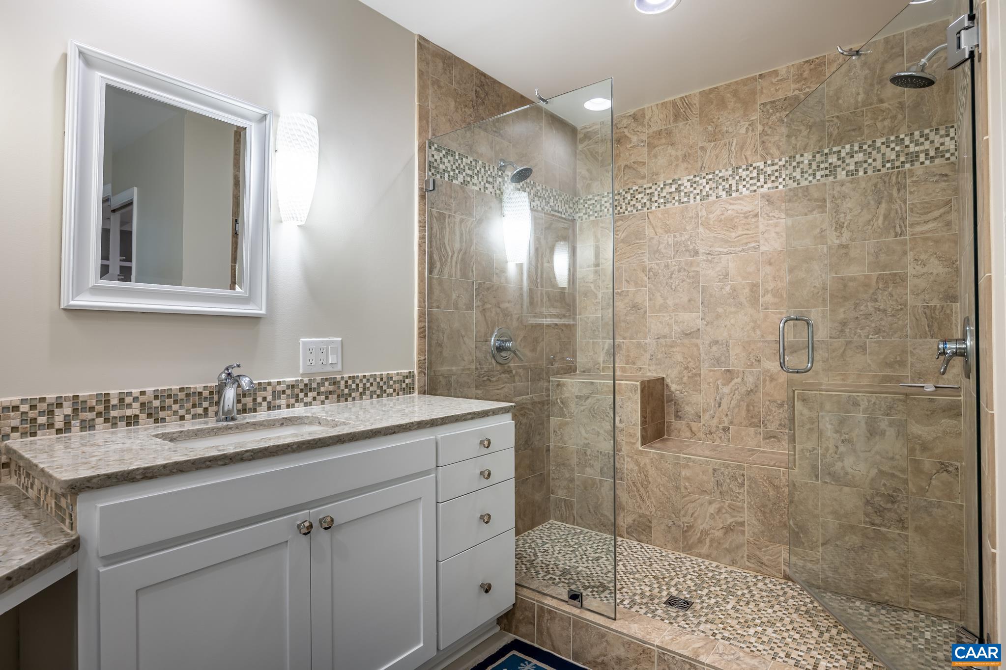 3272 Arbor Trace Charlottesville, VA 22911 - Photo 21 of 46 a bathroom with a shower sink vanity and mirror