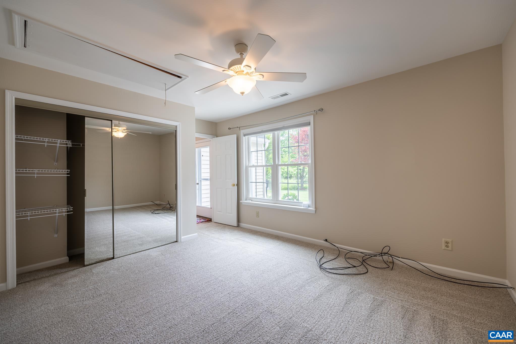 3272 Arbor Trace Charlottesville, VA 22911 - Photo 28 of 46 an empty room with windows and fan