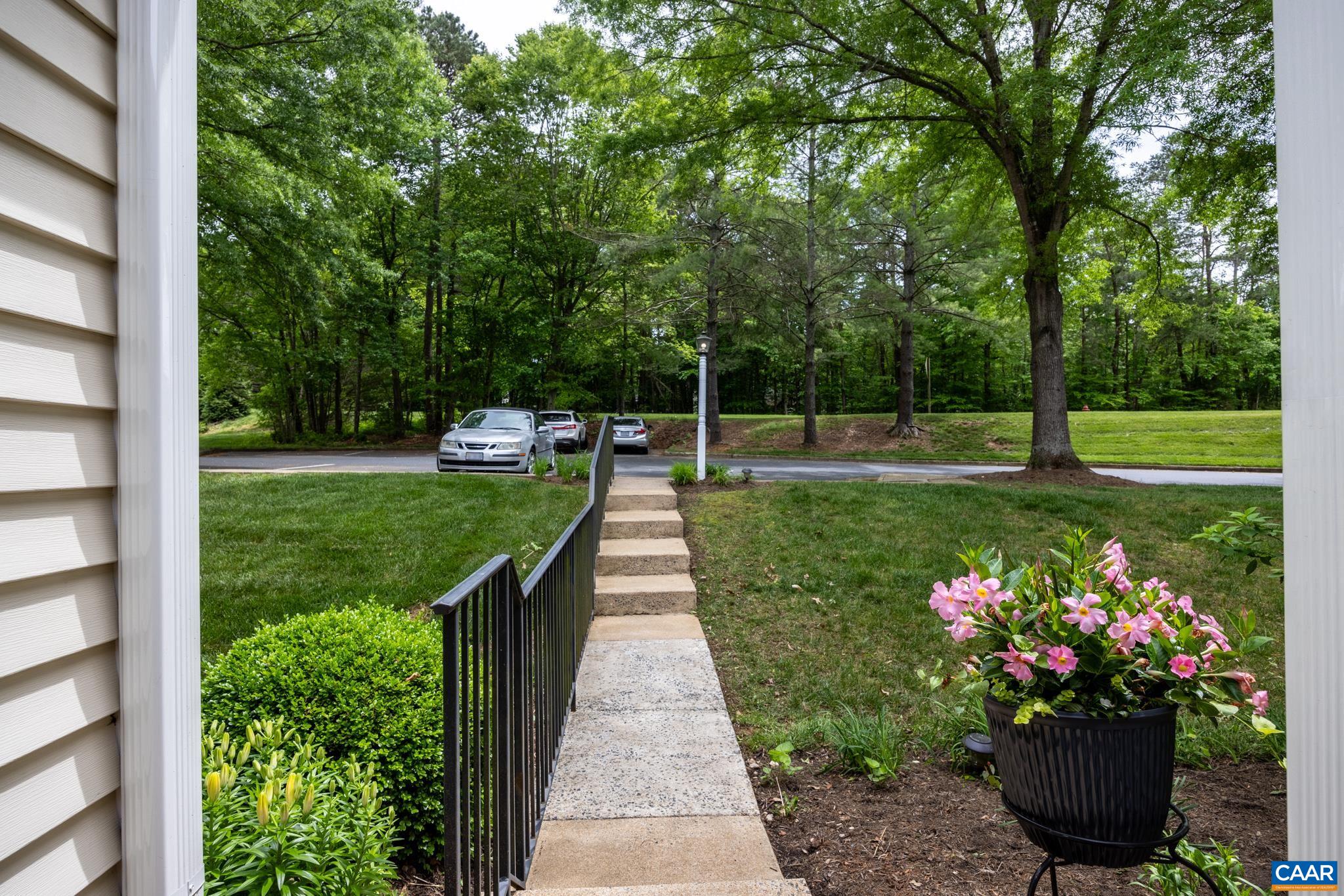 3272 Arbor Trace Charlottesville, VA 22911 - Photo 31 of 46 a view of a garden with a fountain