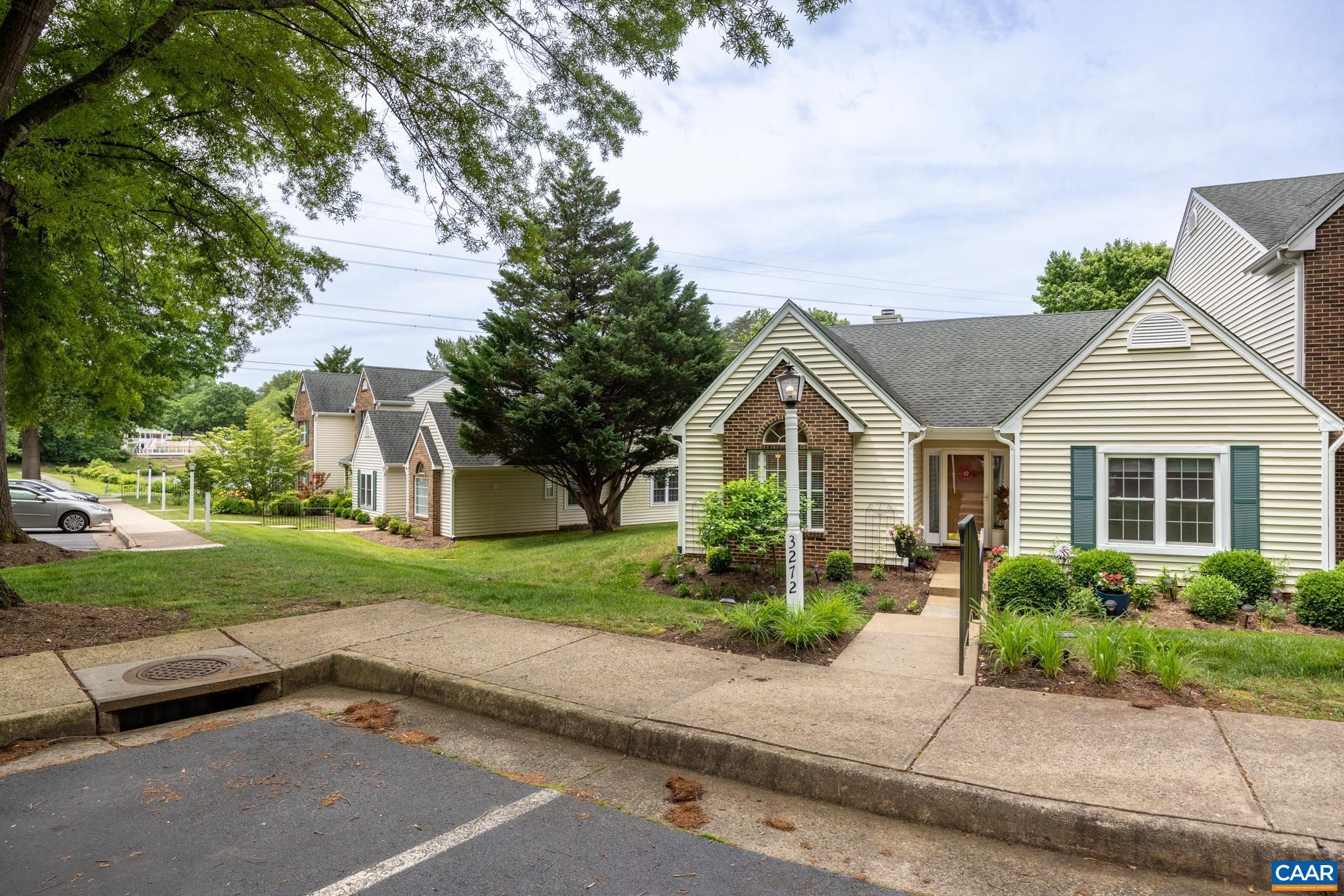 3272 Arbor Trace Charlottesville, VA 22911 - Photo 32 of 46 front view of a house with a yard