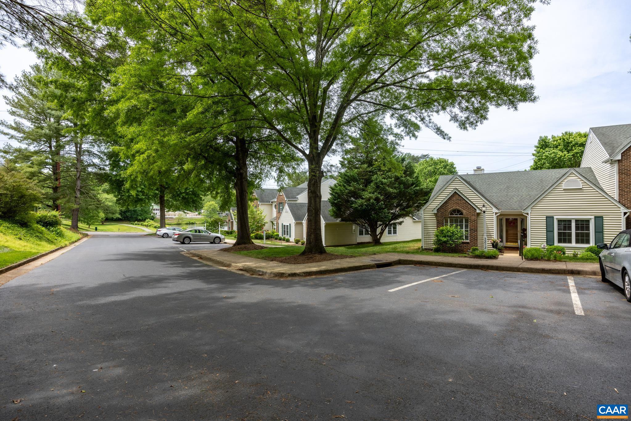 3272 Arbor Trace Charlottesville, VA 22911 - Photo 33 of 46 a view of a house with a big yard and large trees