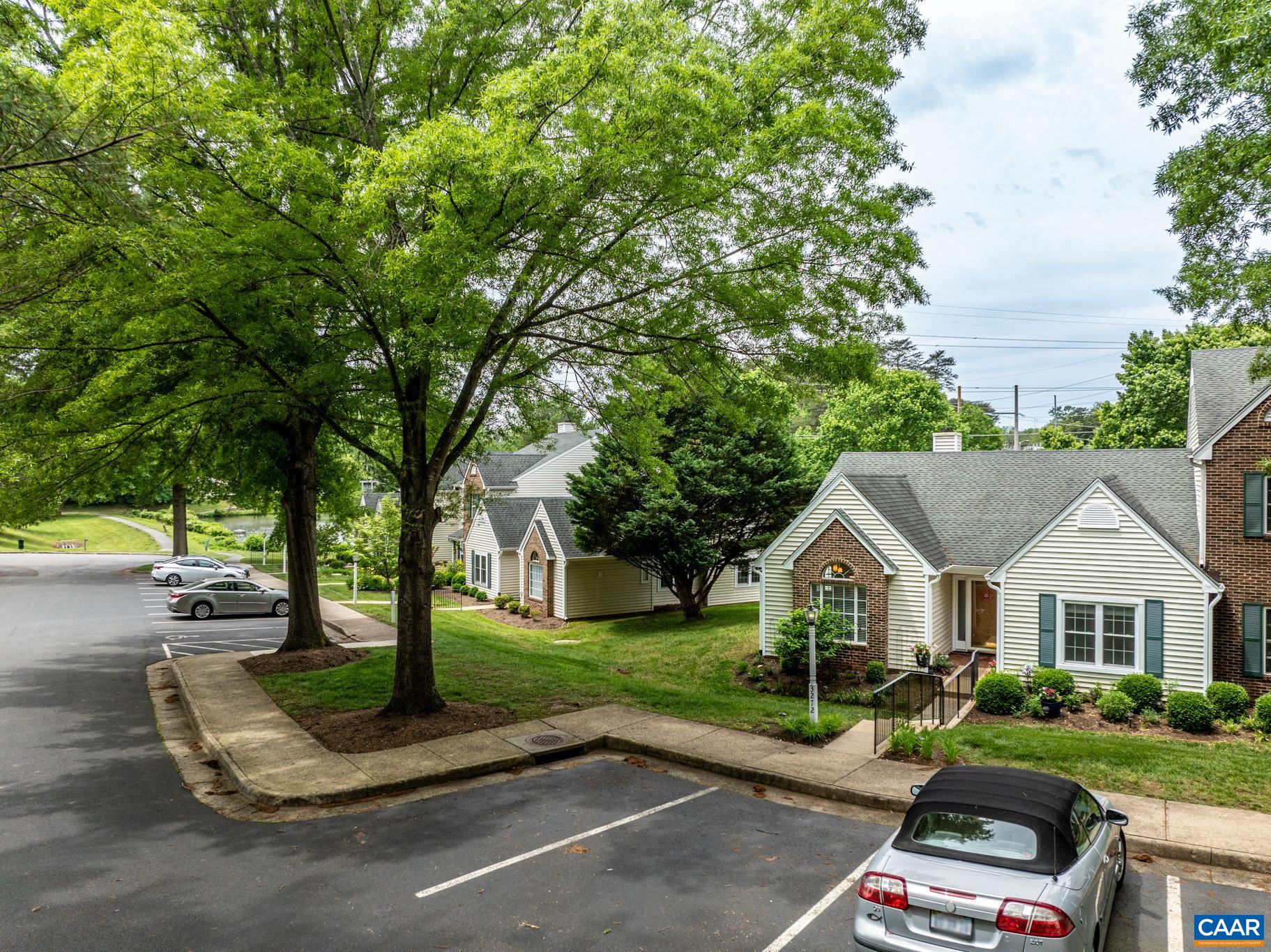 3272 Arbor Trace Charlottesville, VA 22911 - Photo 38 of 46 a front view of a house with a yard and garage