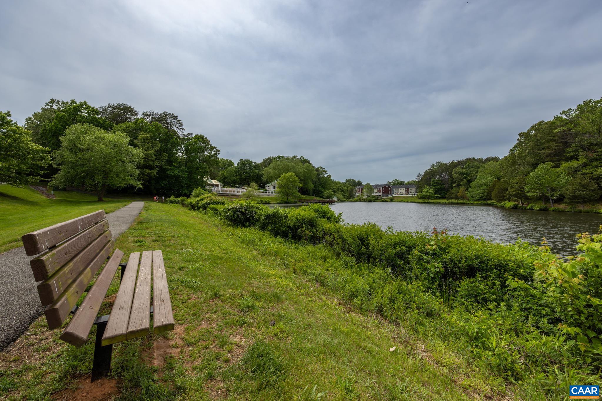 3272 Arbor Trace Charlottesville, VA 22911 - Photo 42 of 46 a view of a lake with a yard