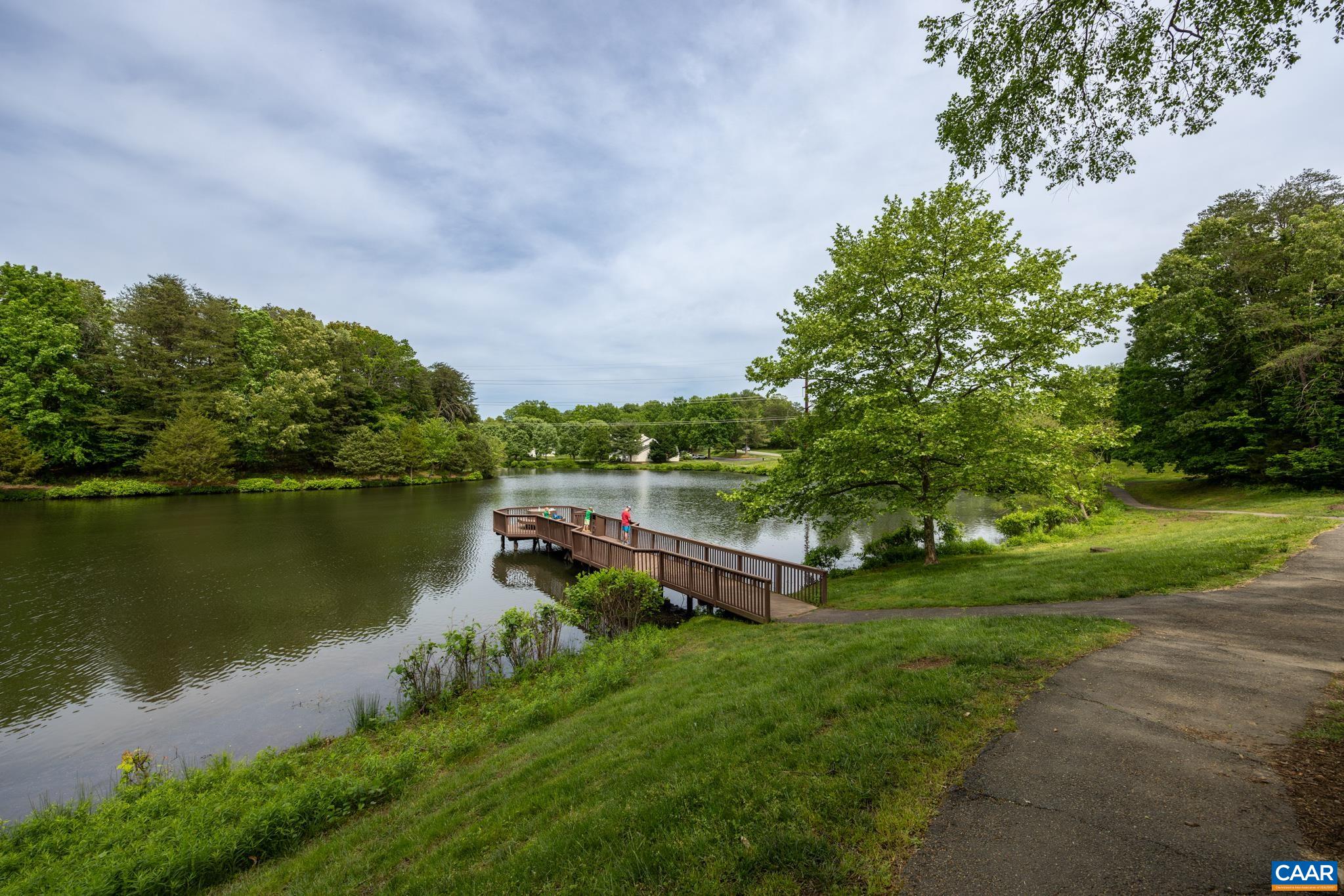 3272 Arbor Trace Charlottesville, VA 22911 - Photo 43 of 46 a view of a lake with houses in the back