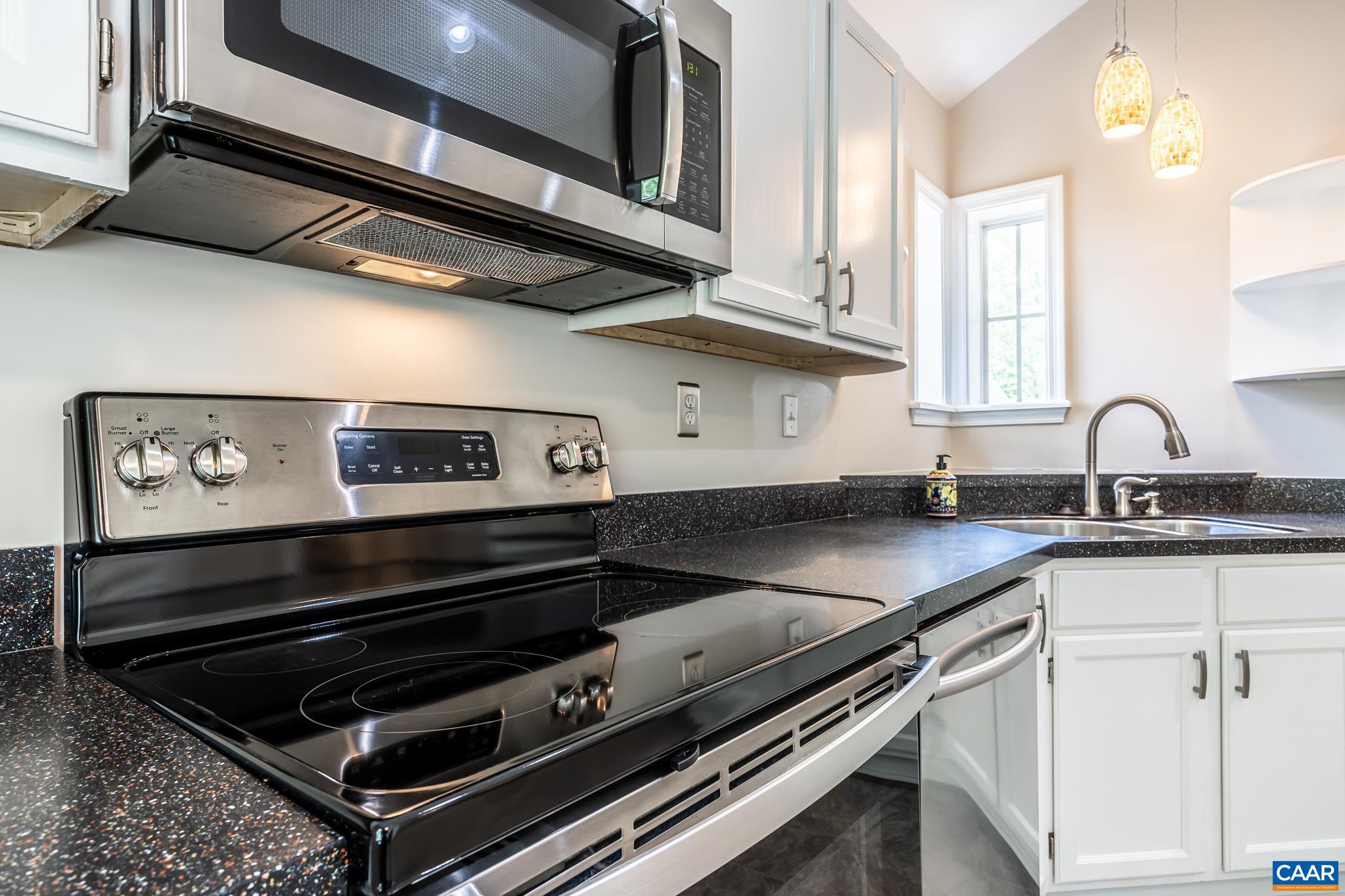 3272 Arbor Trace Charlottesville, VA 22911 - Photo 8 of 46 a kitchen with a stove and a sink