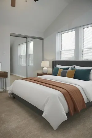 an empty room with a empty space and windows