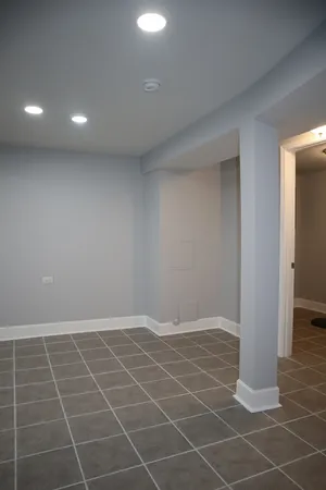 a white toilet sitting next to a bathroom sink