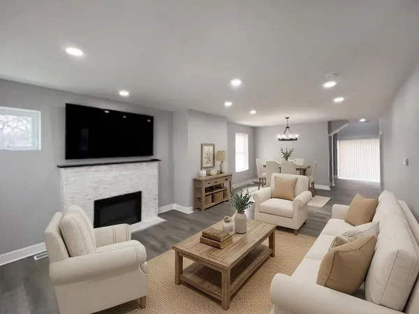 a living room with furniture fireplace and flat screen tv