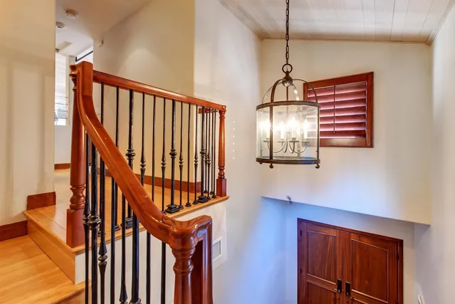 a view of an entryway wooden floor and a window