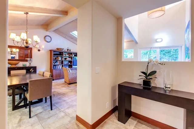 a room with furniture and a potted plant