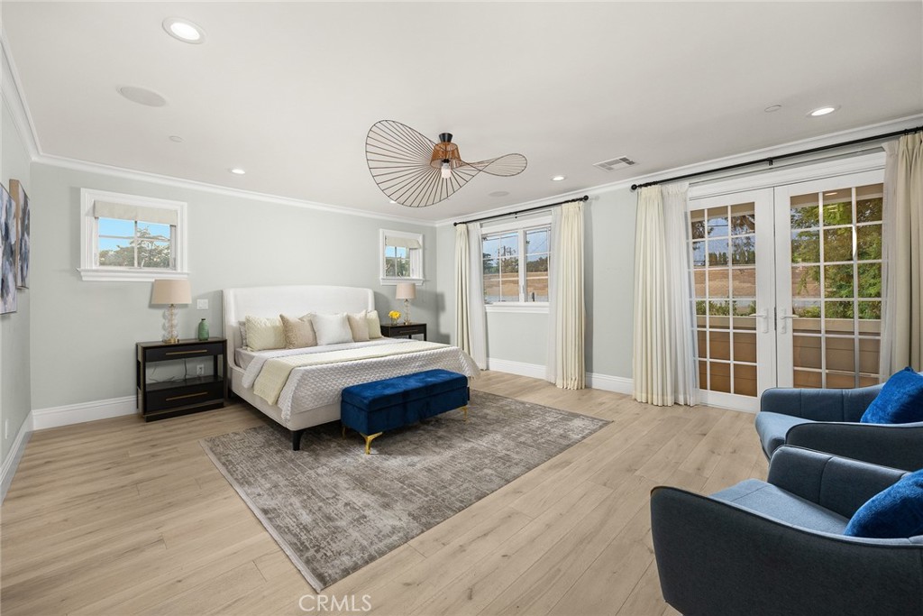 407 Oxford Drive Arcadia, CA 91007 - Photo 19 of 29 a spacious bedroom with a bed a couch and a large window