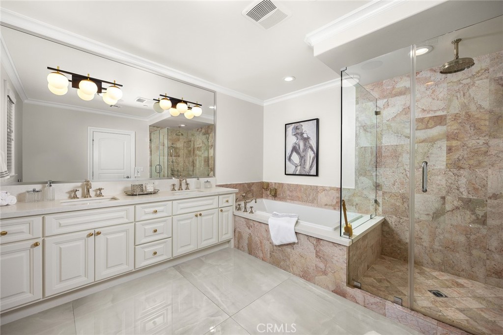 407 Oxford Drive Arcadia, CA 91007 - Photo 22 of 29 a large bathroom with a double vanity sink toilet a mirror and shower