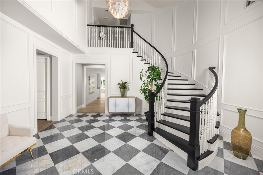 407 Oxford Drive Arcadia, CA 91007 - Photo 4 of 29 a view of a hallway with wooden floor and a dining table