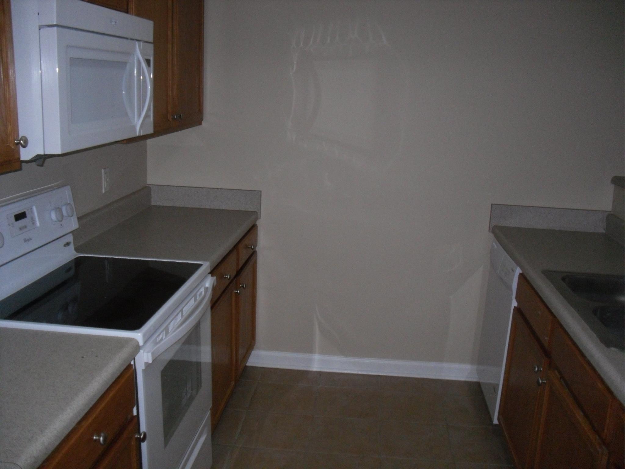 355 Bay Grove Road Freeport, FL 32439 - Photo 2 of 12 a kitchen with a sink a stove and cabinets
