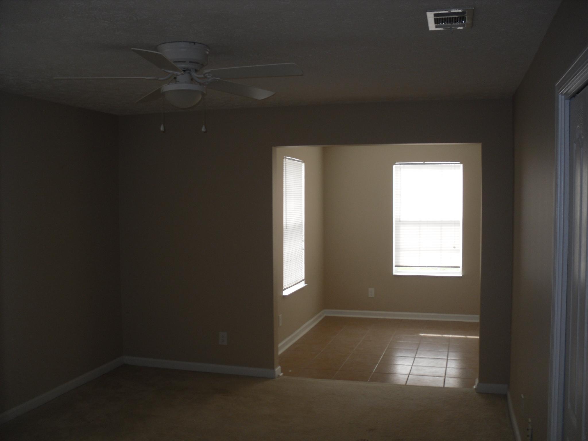 355 Bay Grove Road Freeport, FL 32439 - Photo 8 of 12 wooden floor in an empty room with a window