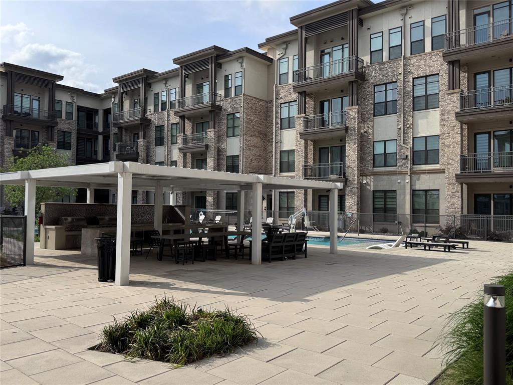 2700 Old Denton Road, Unit 1030 Carrollton, TX 75007 - Photo 15 of 28 a view of a building with that has a lots of windows