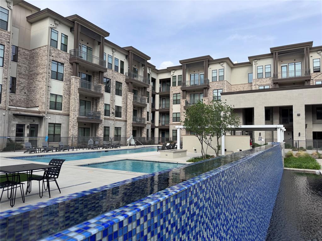 2700 Old Denton Road, Unit 1030 Carrollton, TX 75007 - Photo 16 of 28 a large building with a outdoor space