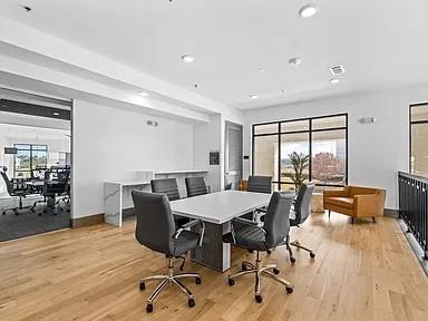 2700 Old Denton Road, Unit 1030 Carrollton, TX 75007 - Photo 17 of 28 a view of a dining room with furniture window and wooden floor