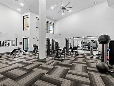 2700 Old Denton Road, Unit 1030 Carrollton, TX 75007 - Photo 18 of 28 a view of a livingroom with furniture and gym equipment
