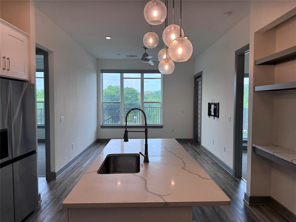 2700 Old Denton Road, Unit 1030 Carrollton, TX 75007 - Photo 2 of 28 a kitchen with sink and refrigerator