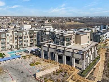 2700 Old Denton Road, Unit 1030 Carrollton, TX 75007 - Photo 21 of 28 an aerial view of a house with a yard