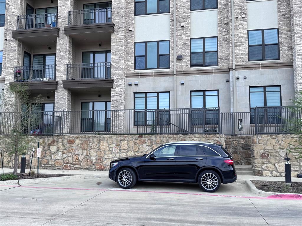 2700 Old Denton Road, Unit 1030 Carrollton, TX 75007 - Photo 23 of 28 a car parked in front of a building