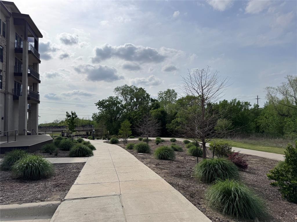 2700 Old Denton Road, Unit 1030 Carrollton, TX 75007 - Photo 24 of 28 a view of a pathway with a yard