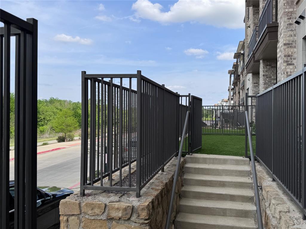 2700 Old Denton Road, Unit 1030 Carrollton, TX 75007 - Photo 26 of 28 a view of a backyard with pathway
