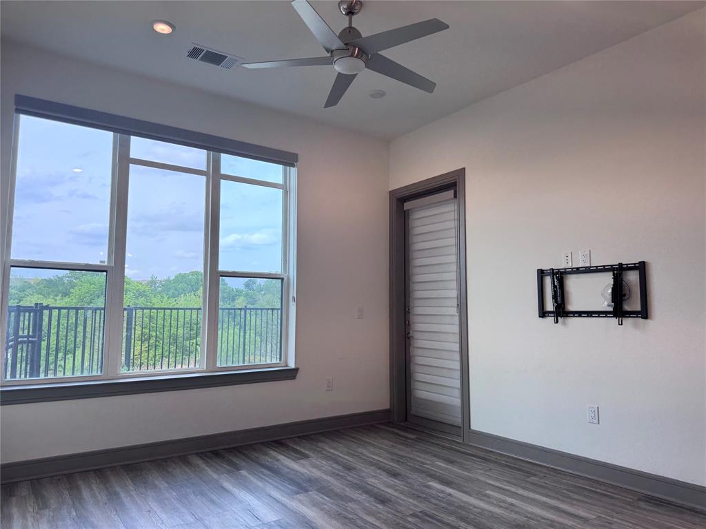 2700 Old Denton Road, Unit 1030 Carrollton, TX 75007 - Photo 7 of 28 a view of livingroom with hardwood floor and window