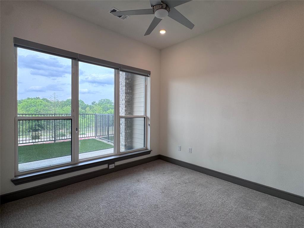 2700 Old Denton Road, Unit 1030 Carrollton, TX 75007 - Photo 10 of 28 a view of room with window and ceiling fan