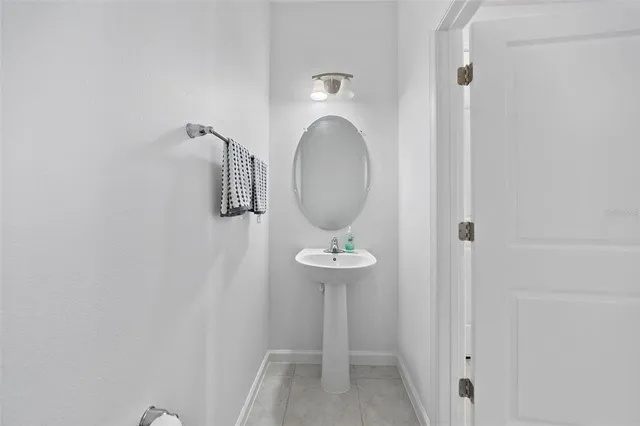 a living room with a bed furniture and a flat tv screen