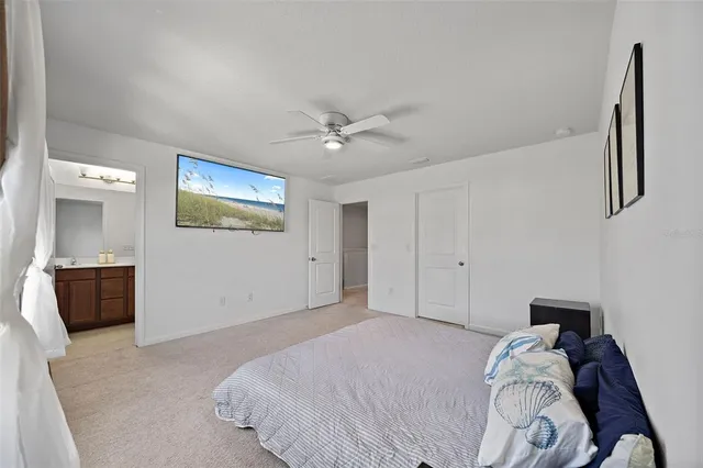 a bathroom with a double vanity sink toilet mirror and shower